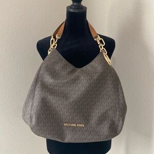 Michael Kori’s Brown slouch handbag